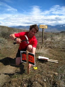 James Varner stakes down a trail race sign