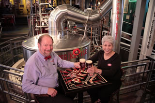 Cheers! Pike Brewery owners Charles and Rose Ann Finkel enjoy some down time at their Pike Place brew pub. Photo courtesy of Pike Brewery